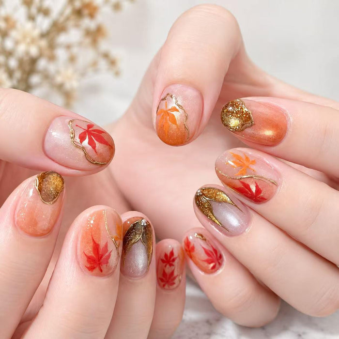 Autumn Maple Leaf Press-On Nails With Gold Glitter and Metallic Accents