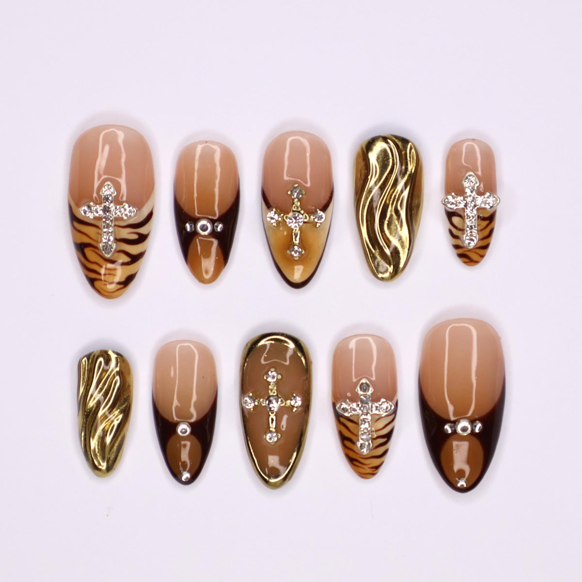 Autumn Tiger Print French Tip Nails with Rhinestone Crosses and Gold Chrome