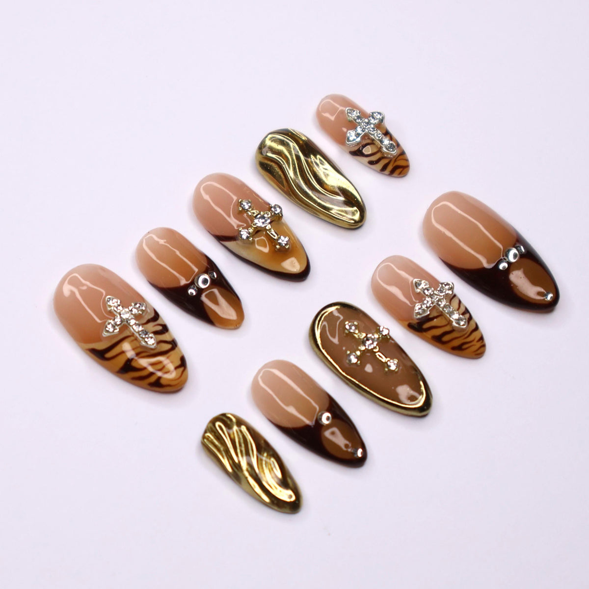 Autumn Tiger Print French Tip Nails with Rhinestone Crosses and Gold Chrome