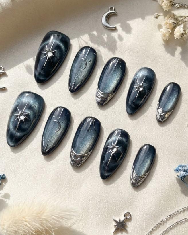 Black and Navy Cat Eye Nails with Chrome Starbursts and Metallic French Tips
