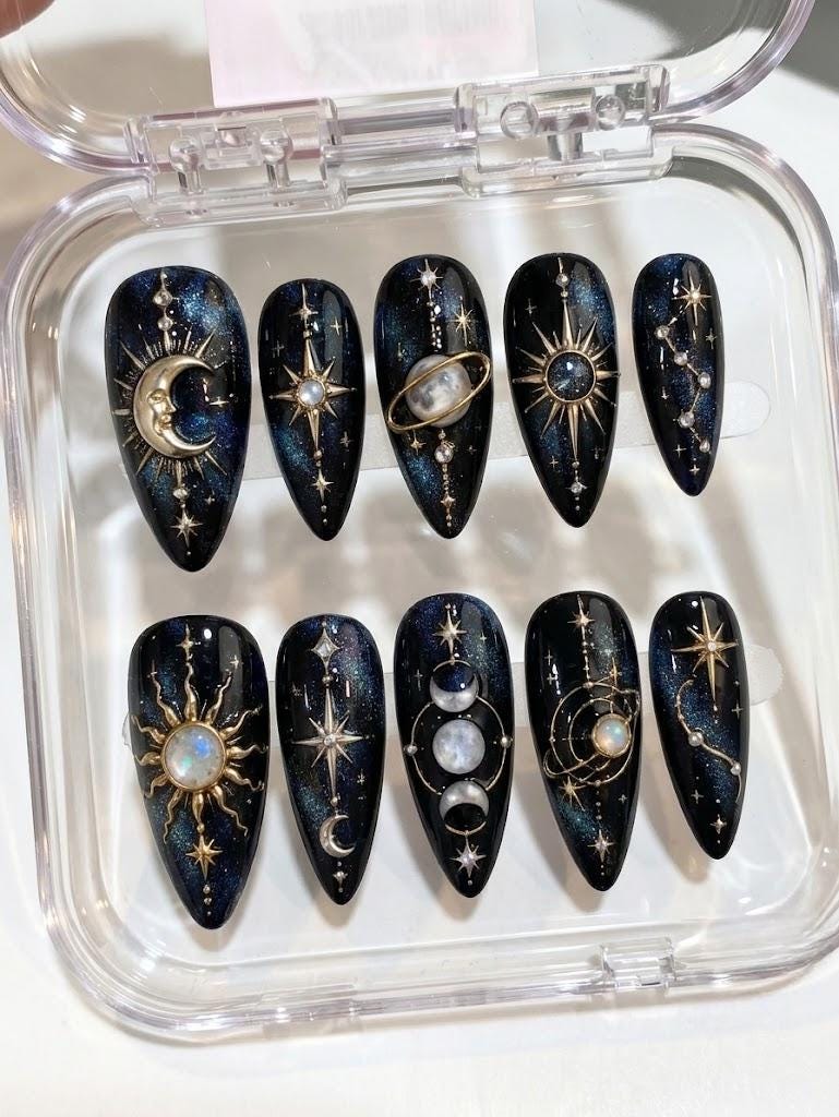 Black and Navy Celestial Galaxy Nails with Raised Gold Sun, Moon and Star Details
