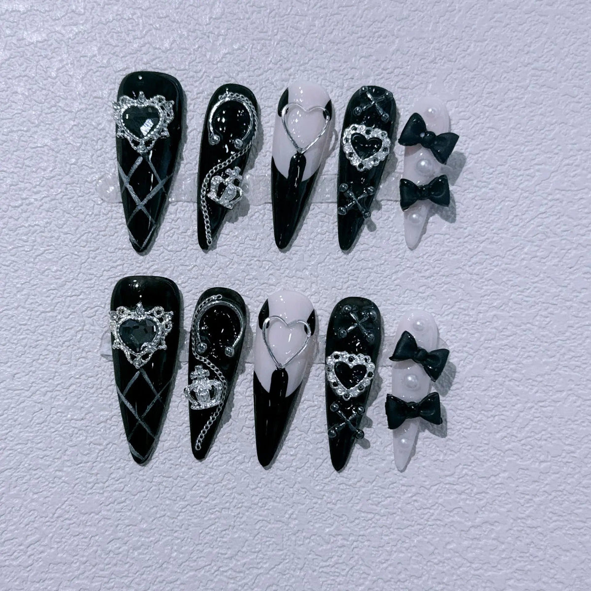 Black and Pale Pink Halloween Nails with Silver Hearts, Rhinestones and Bows