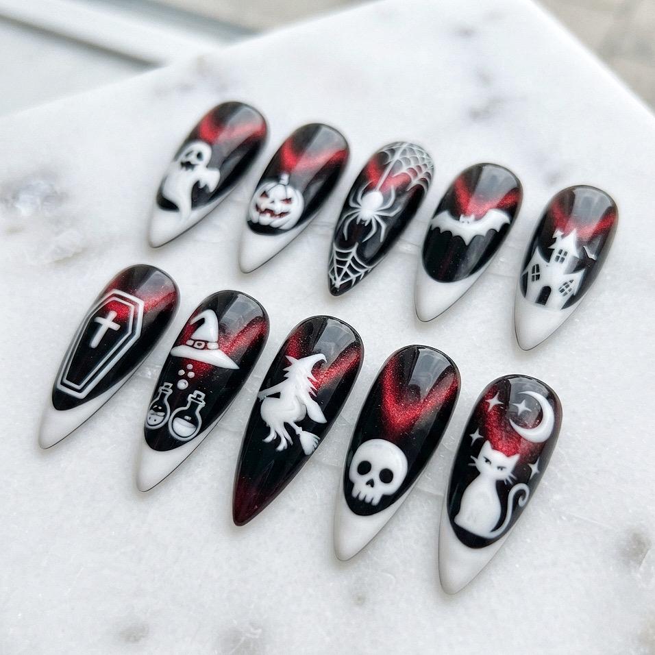 Black and Red Cat Eye Halloween Nails with Spooky White Designs