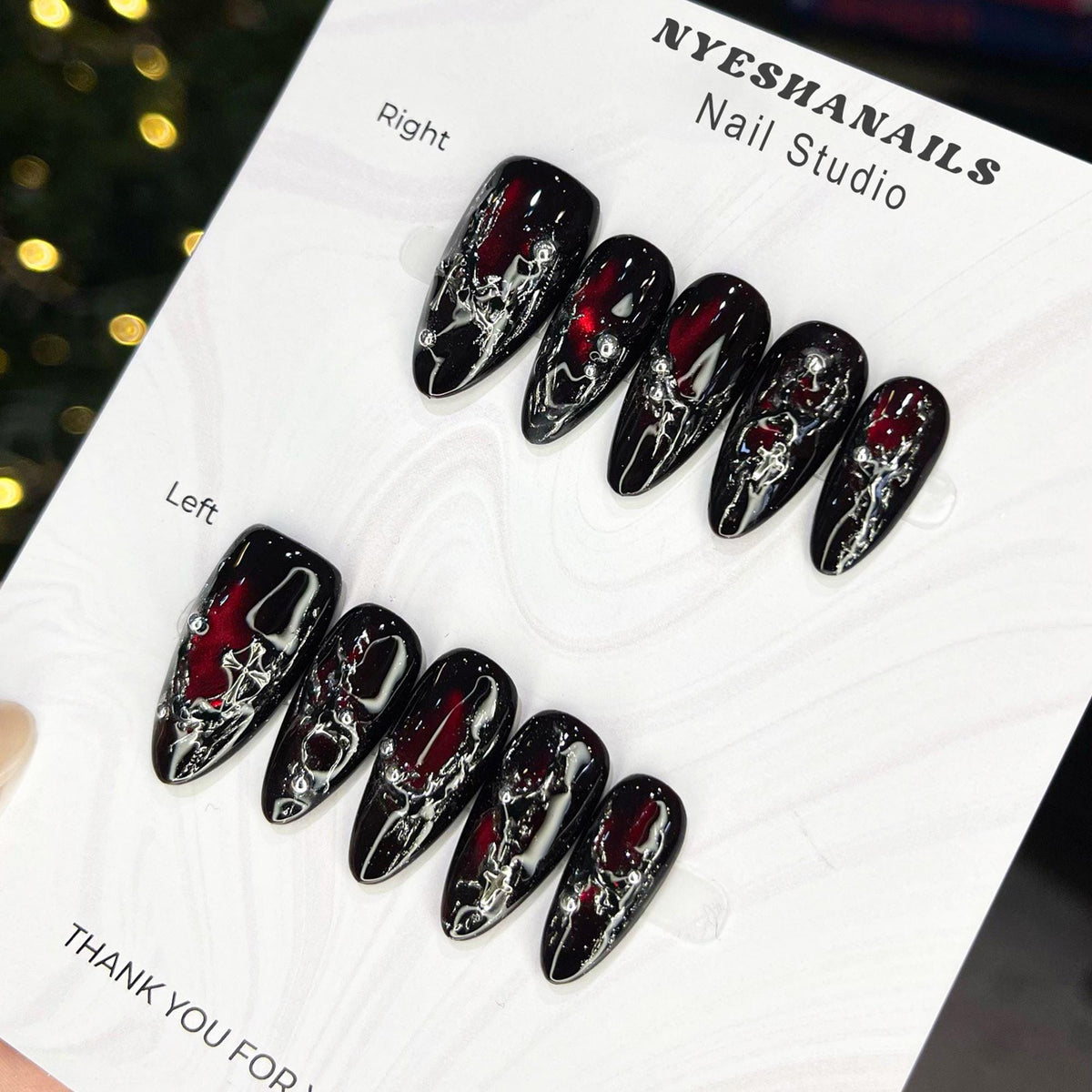 Black and Red Cat Eye Nails with Silver Molten Veining and Cross Accents