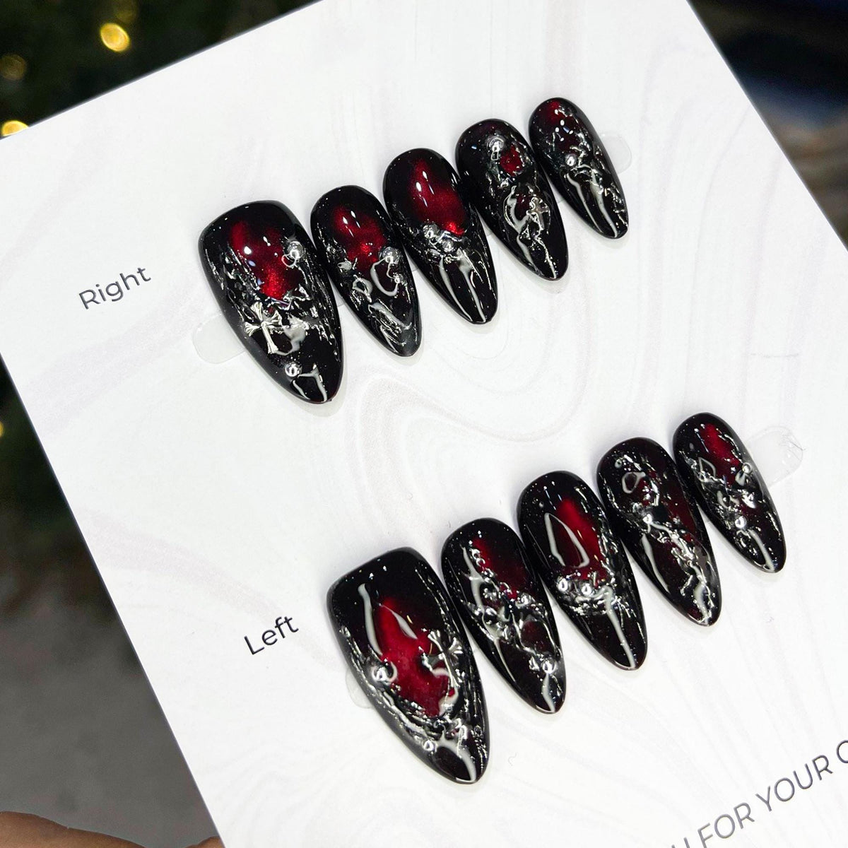 Black and Red Cat Eye Nails with Silver Molten Veining and Cross Accents