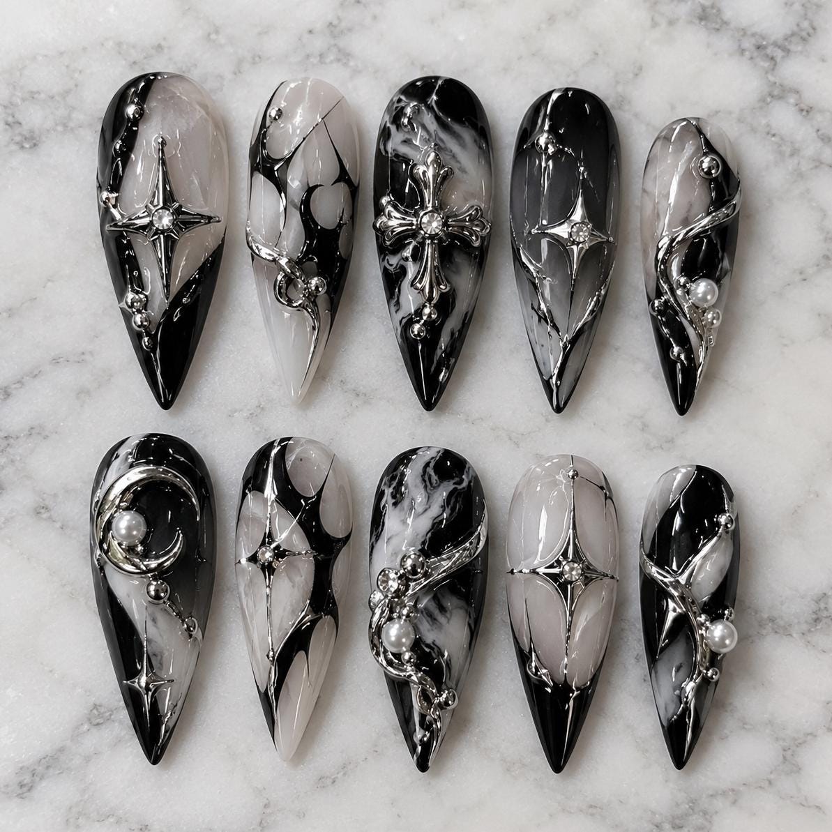 Black and Silver Marble Nails with Chrome Accents, Cross Charms and Rhinestones