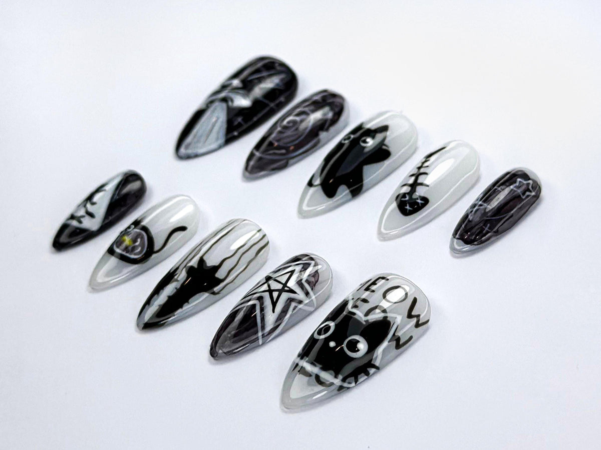 Black and White Cosmic Cat Nail Set with Stars and Spooky Motifs