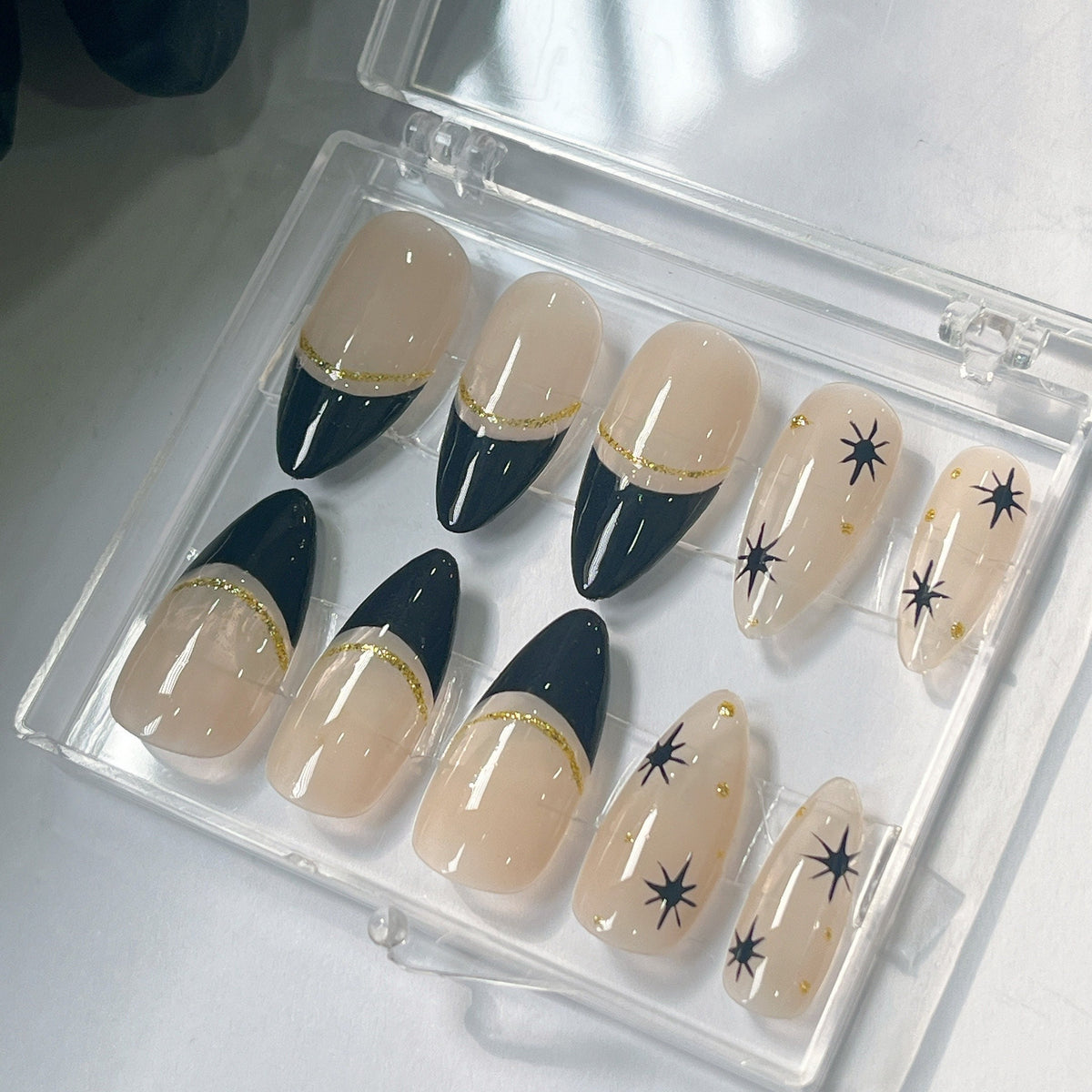 Black French Tip Press On Nails With Gold Glitter and Starburst Accents