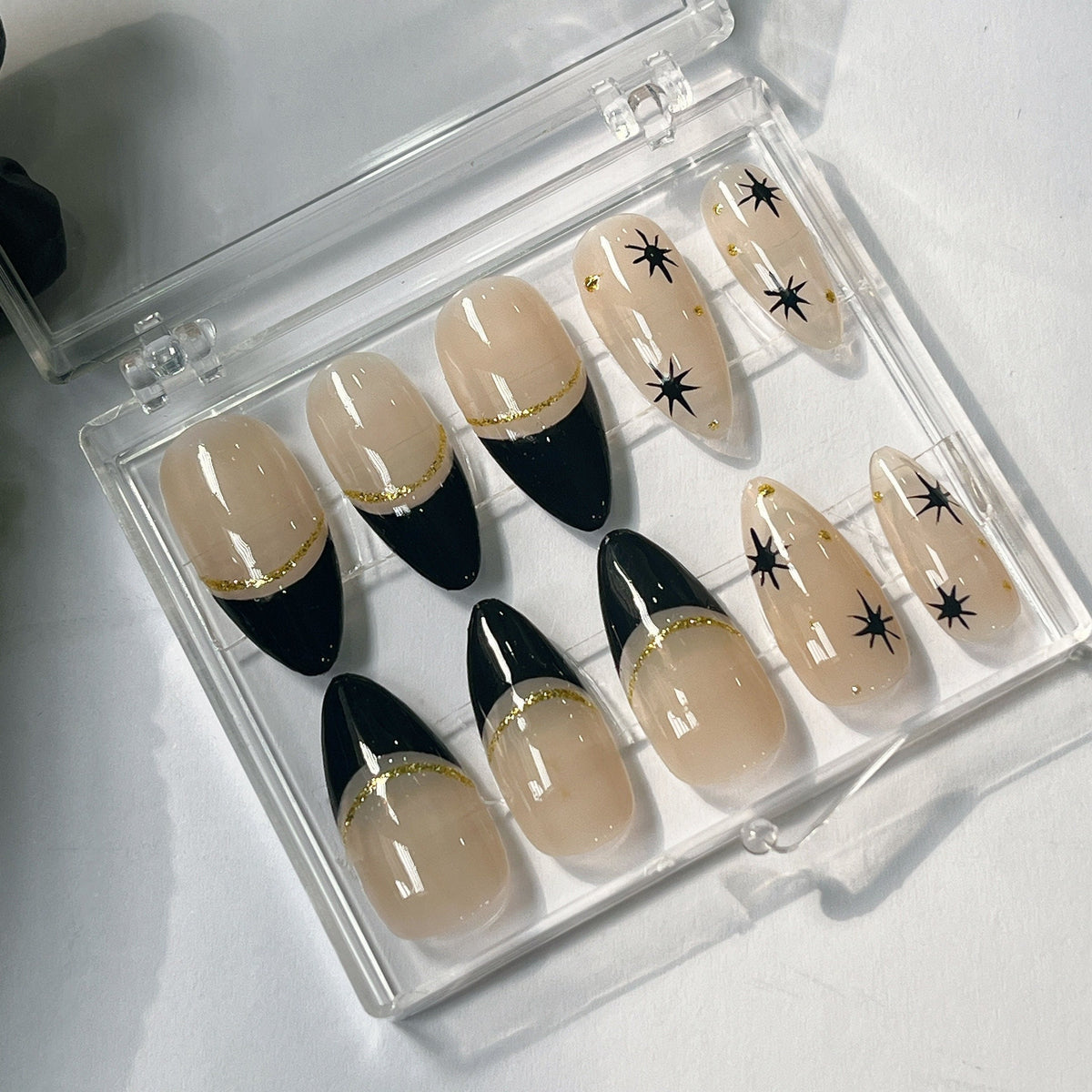 Black French Tip Press On Nails With Gold Glitter and Starburst Accents