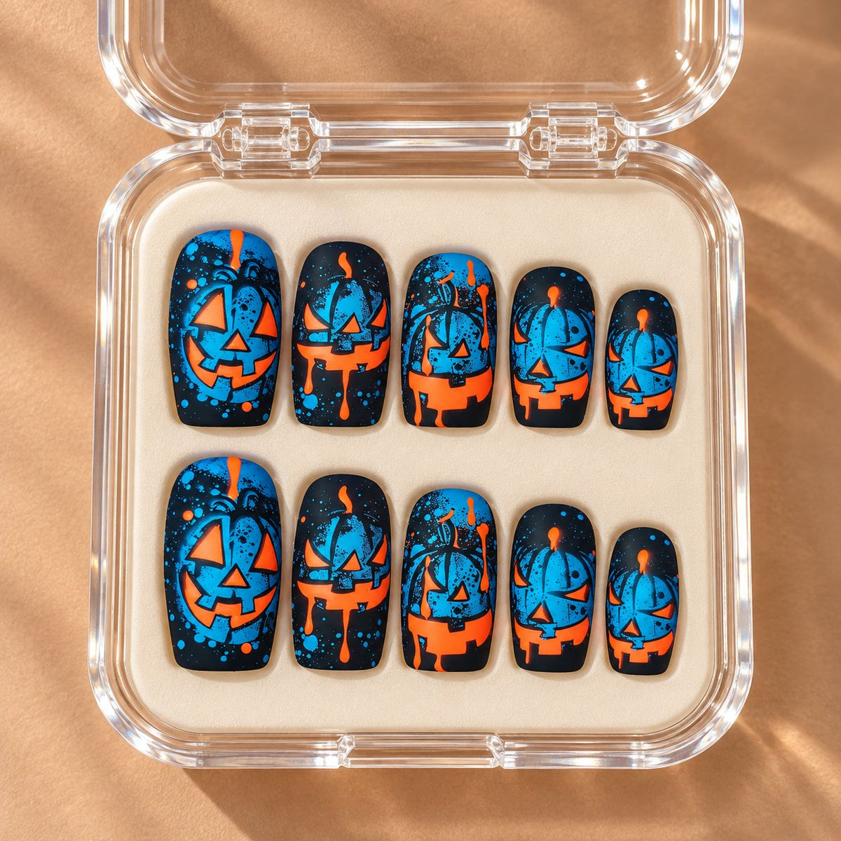 Blue and Orange Jack-o'-Lantern Halloween Press On Nails in clear acrylic storage box