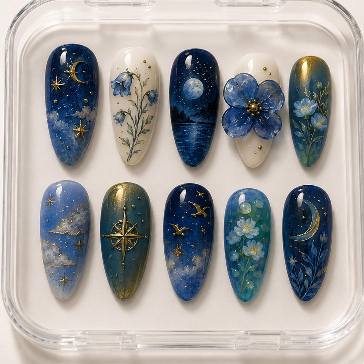 Blue Celestial Floral Press-On Nail Set With Gold Moons, Stars, and Compass
