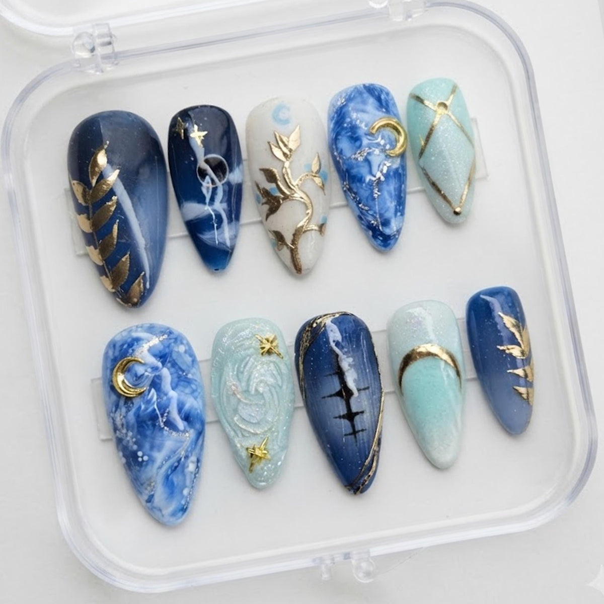 Blue Celestial Marble Press-On Nails With Gold Moon and Star Details