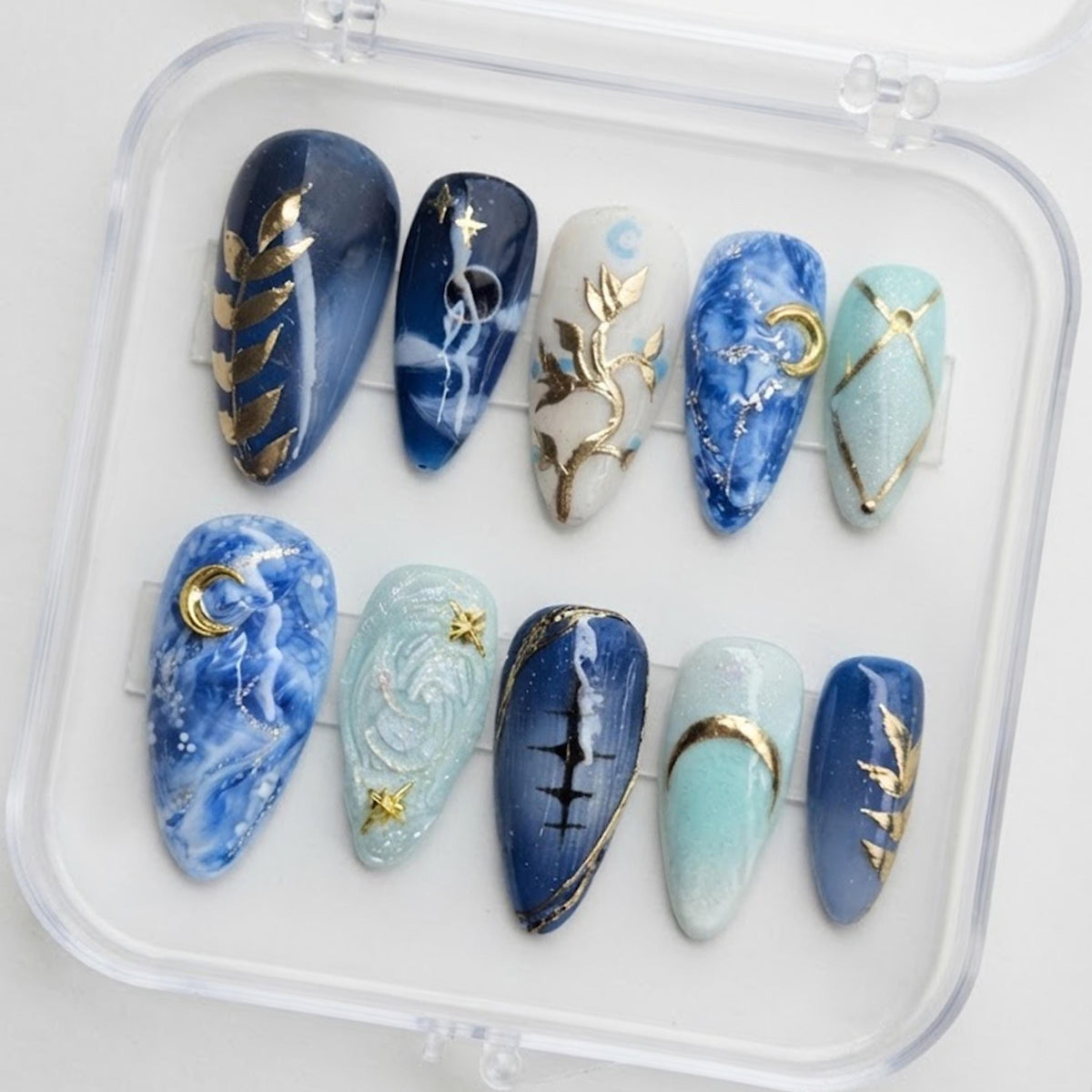 Blue Celestial Marble Press-On Nails With Gold Moon and Star Details