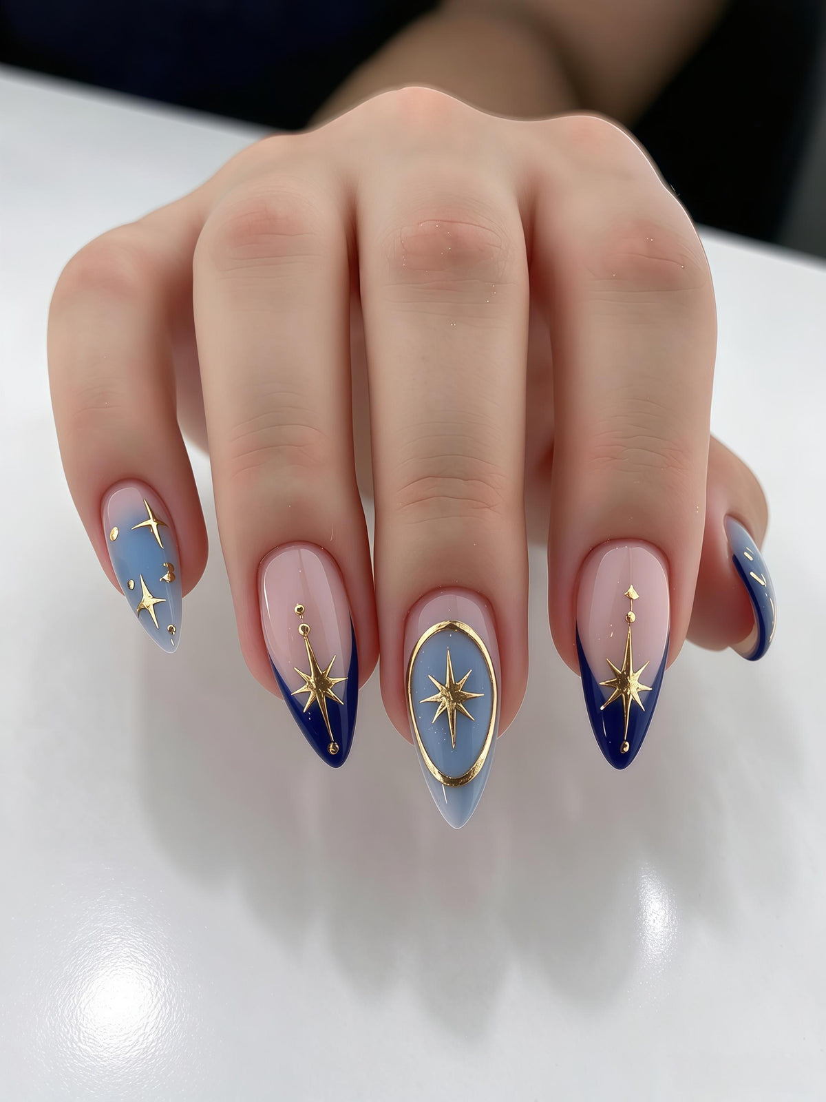 Blue Ombre Nails With Gold Starbursts