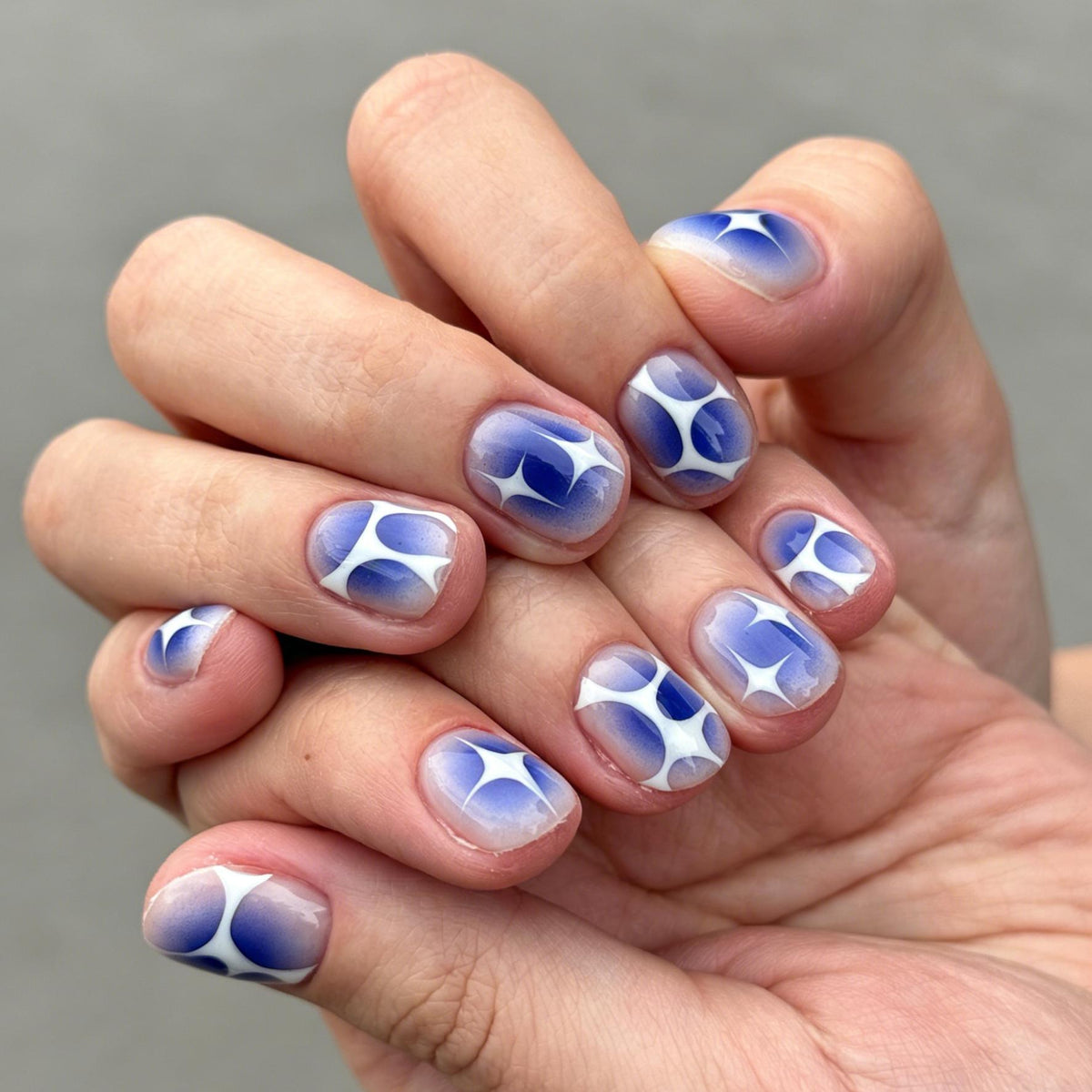 Blue Ombre Starburst Press-On Nails With White Abstract Accents