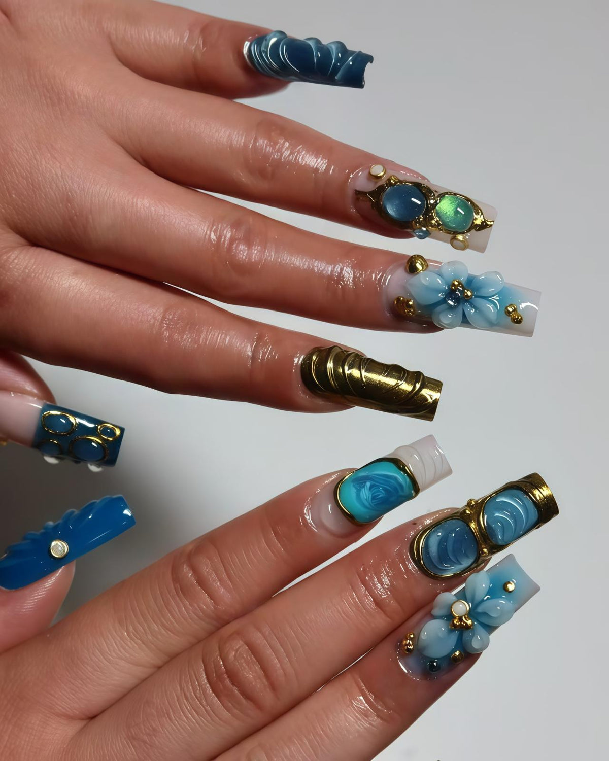 Blue Sculpted Flower and Gold Nail Set With Jeweled Accents