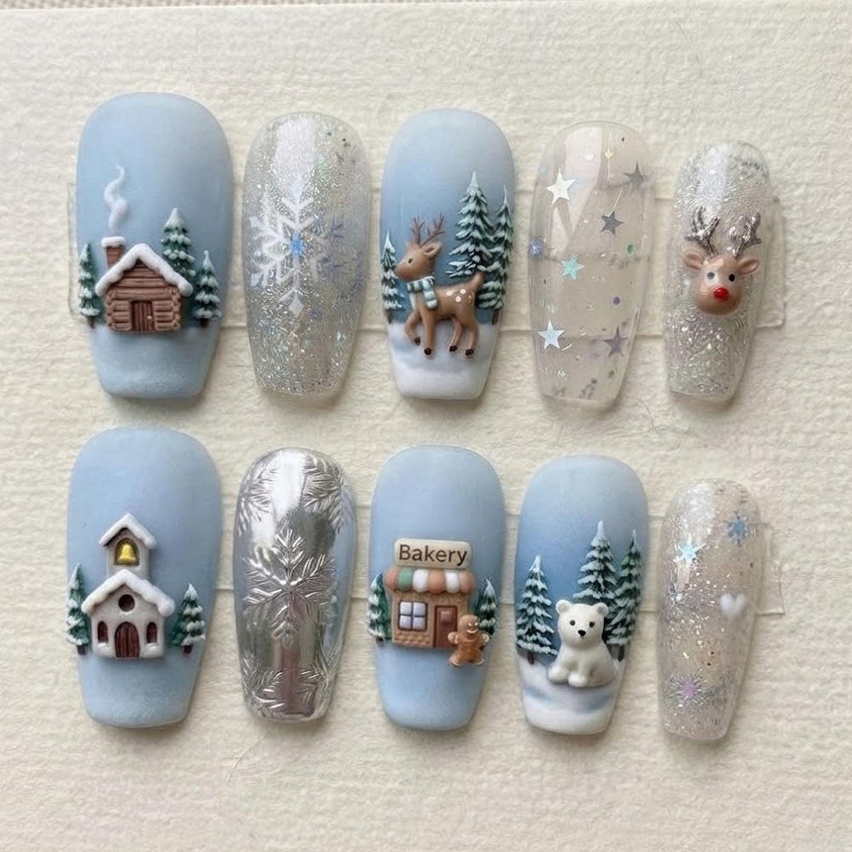 Blue Winter Wonderland Nails with Snowflakes, Snowy Trees, and 3D Reindeer
