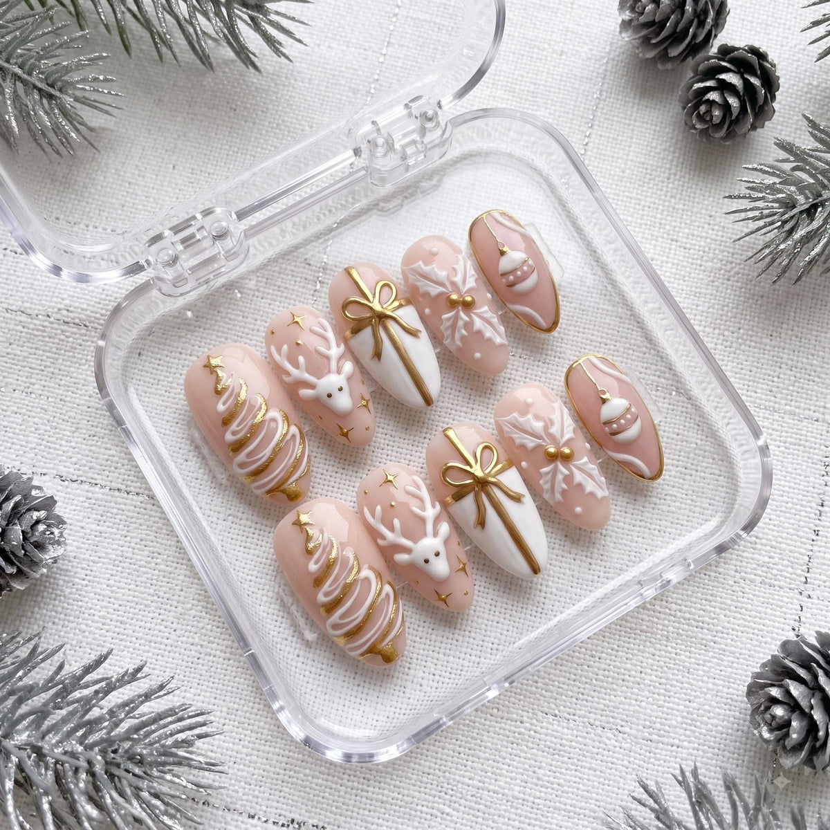 Blush Christmas Press On Nails With Gold Reindeer, Trees, Bows and Snowflakes