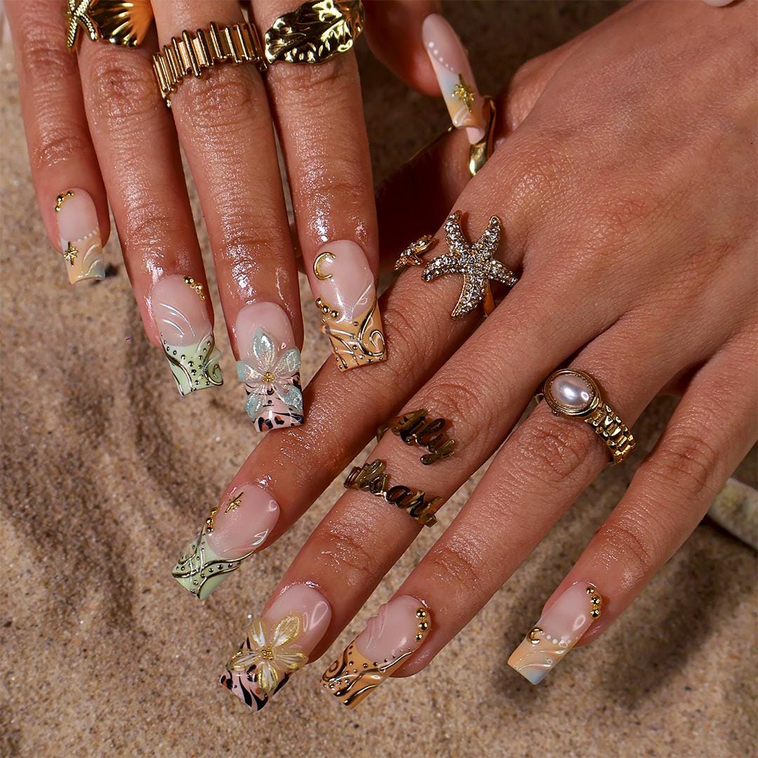 Blush Nude Celestial Floral Nails With Gold Chrome and Animal Print