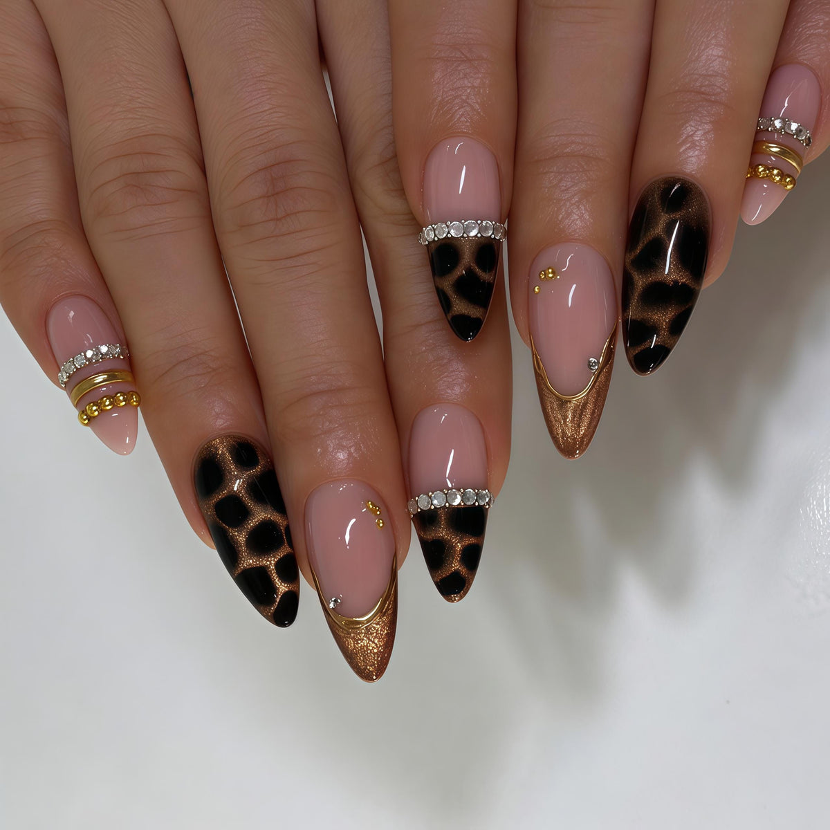 Blush Pink and Black Leopard Print Nails with Gold Details and Rhinestones