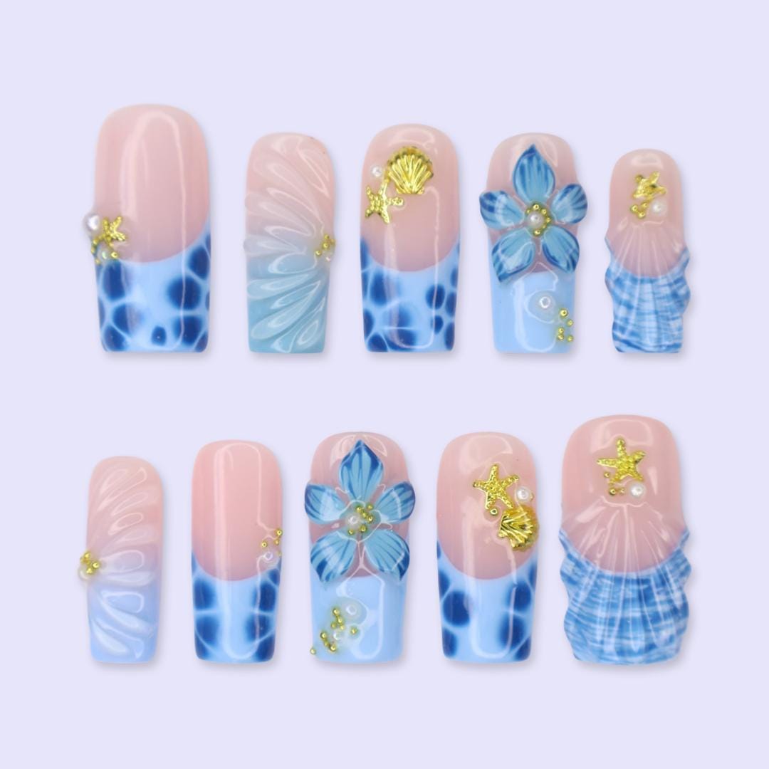 Blush Pink and Blue Ocean Nails with Tropical Flowers, Shells and Gold Charms
