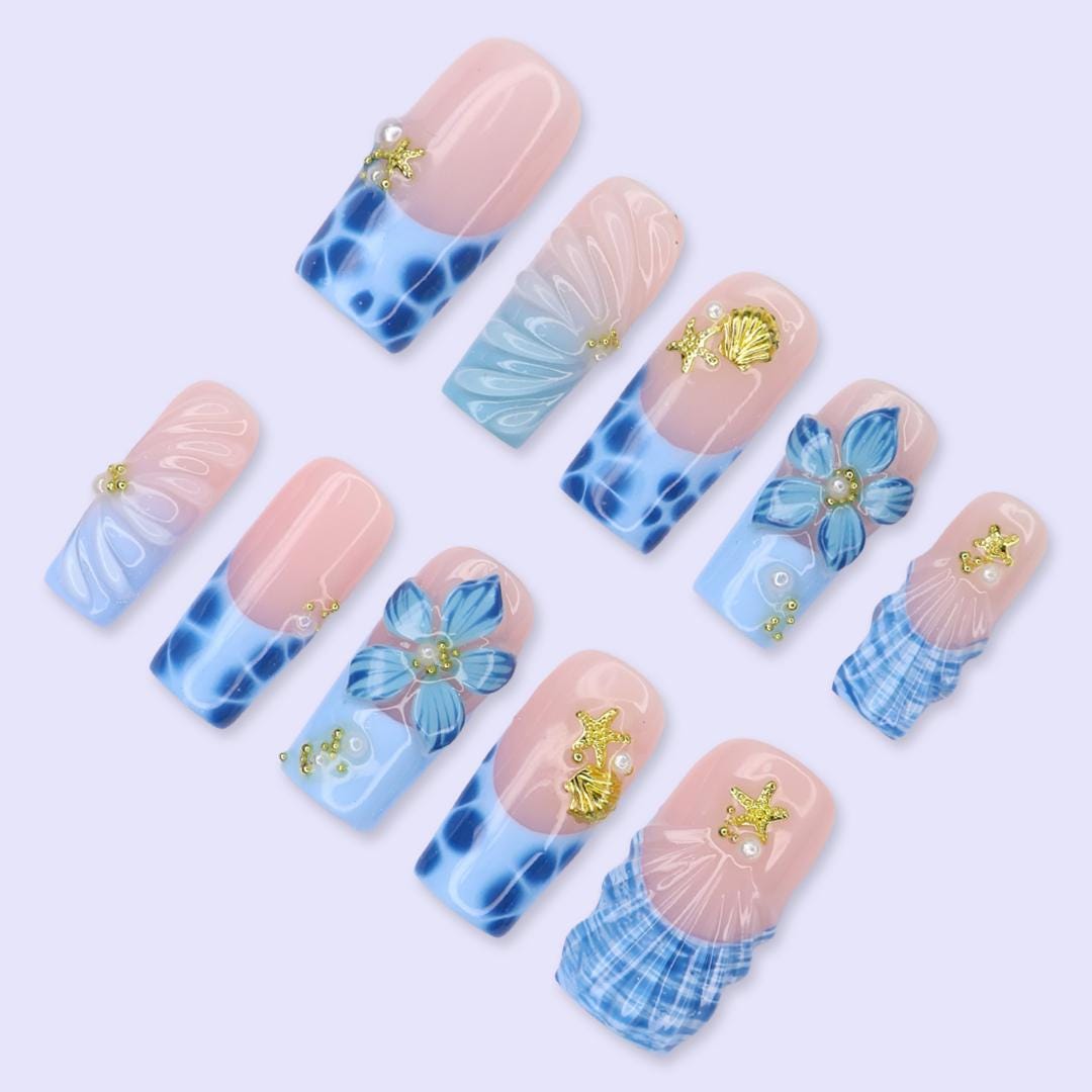 Blush Pink and Blue Ocean Nails with Tropical Flowers, Shells and Gold Charms