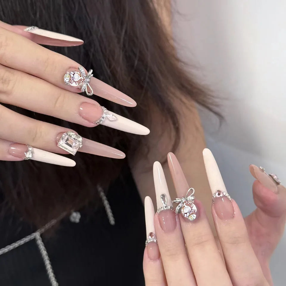 Blush Pink and Milky White French Tip Nails with Silver-Tone Rhinestone Accents