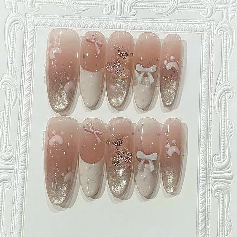 Blush Pink and White French Tip Nails with Silver Cat-Eye Glitter and Bows