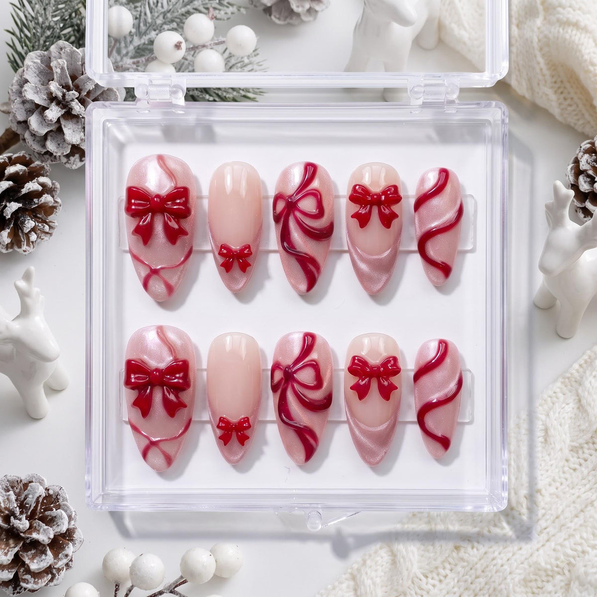 Blush Pink Christmas Press-On Nails With Raised Red Bows and Ribbon Details