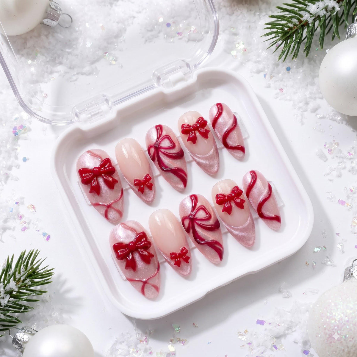 Blush Pink Christmas Press-On Nails With Raised Red Bows and Ribbon Details