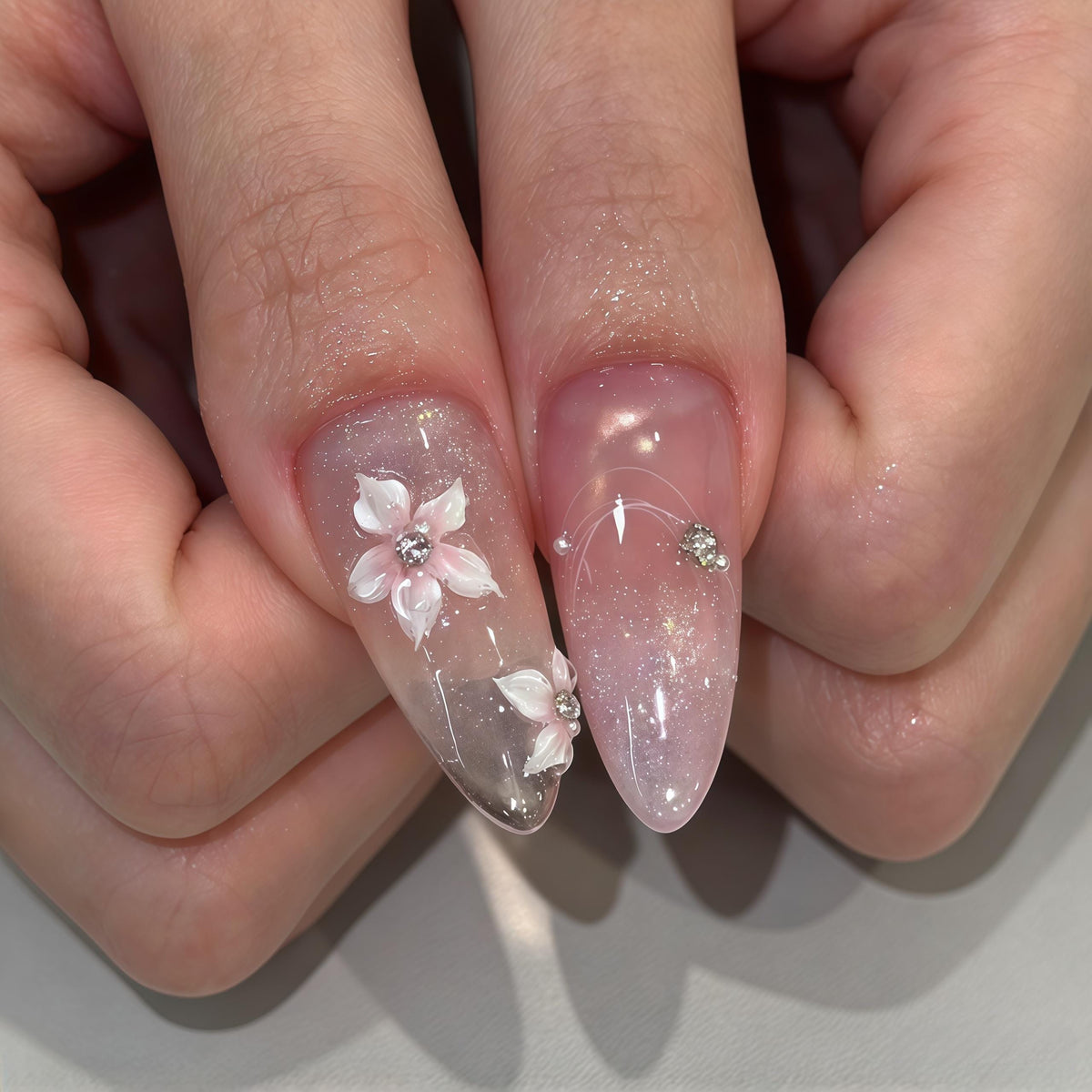 Blush Pink Gradient Nails With 3D White Flowers, Rhinestones & Iridescent Glitter