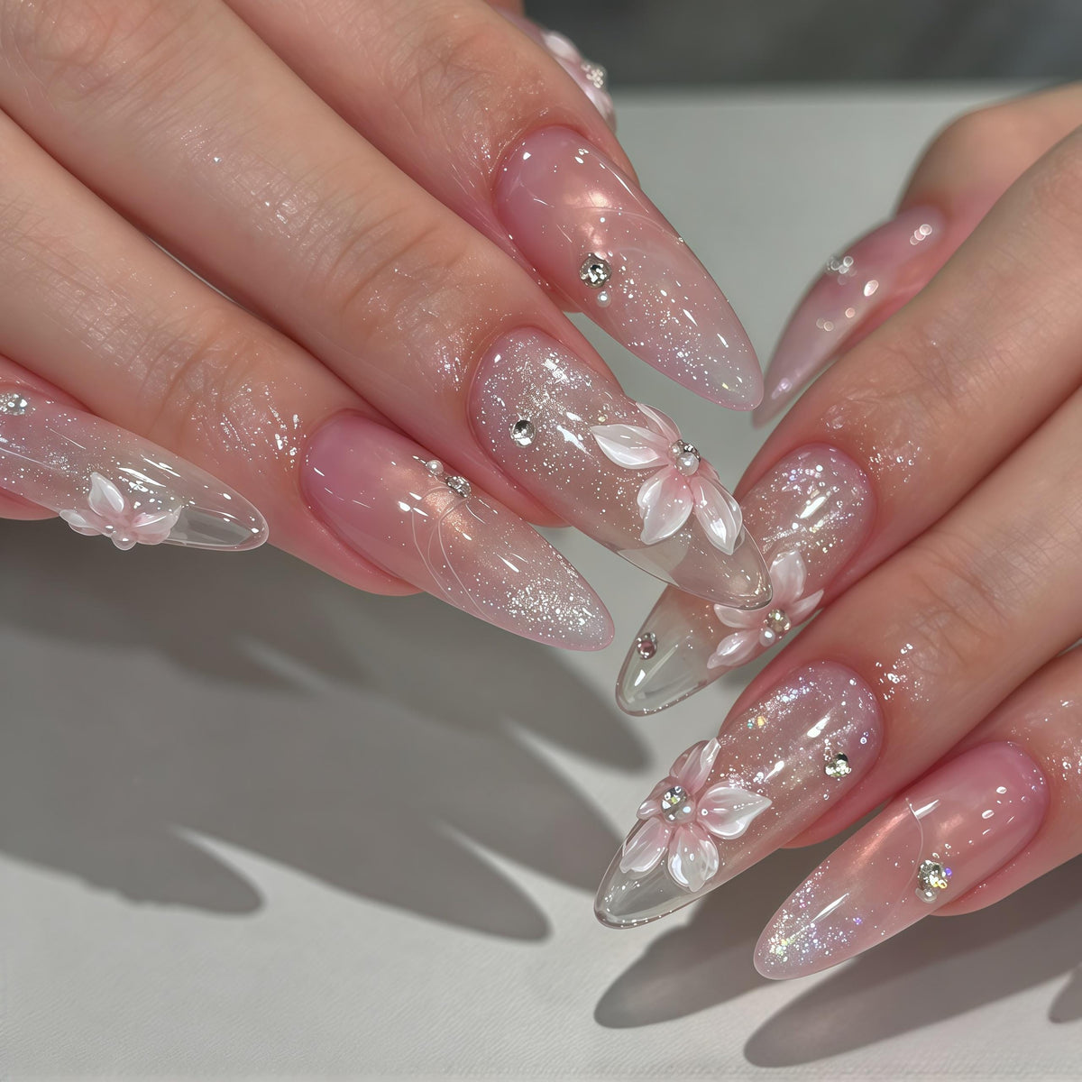 Blush Pink Gradient Nails With 3D White Flowers, Rhinestones & Iridescent Glitter
