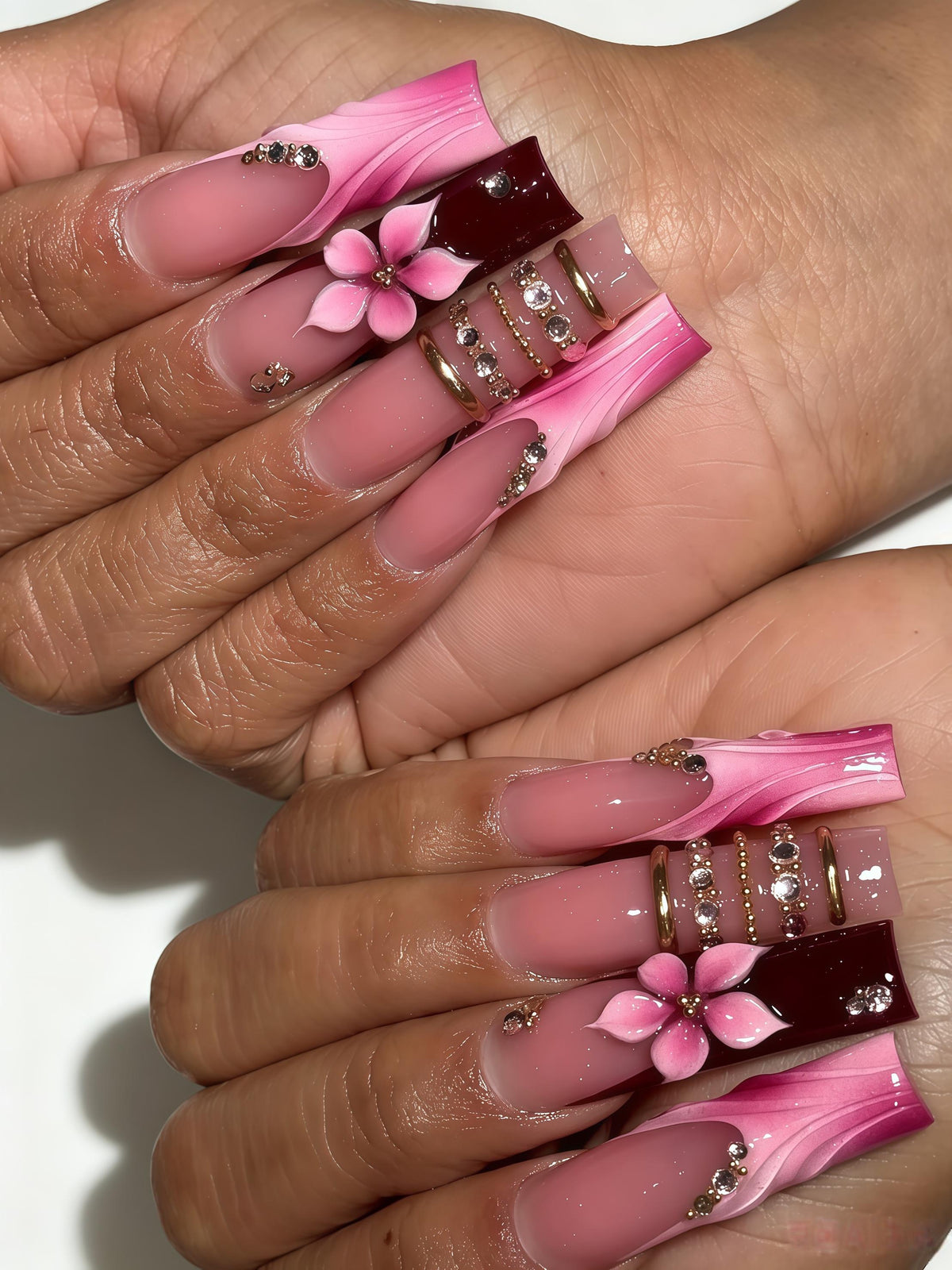 Blush Pink Marbled Tip Nails with 3D Flowers, Burgundy Accents, Gold Bands and Rhinestones
