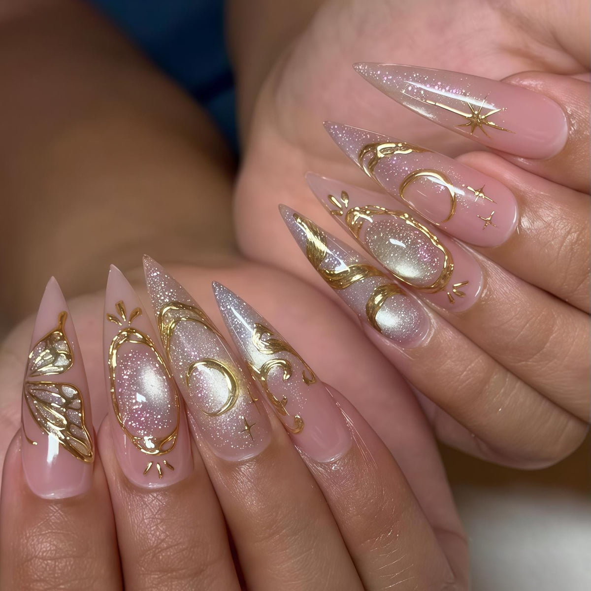 Blush Pink Nails With Ornate Gold Swirls and Reflective Accents