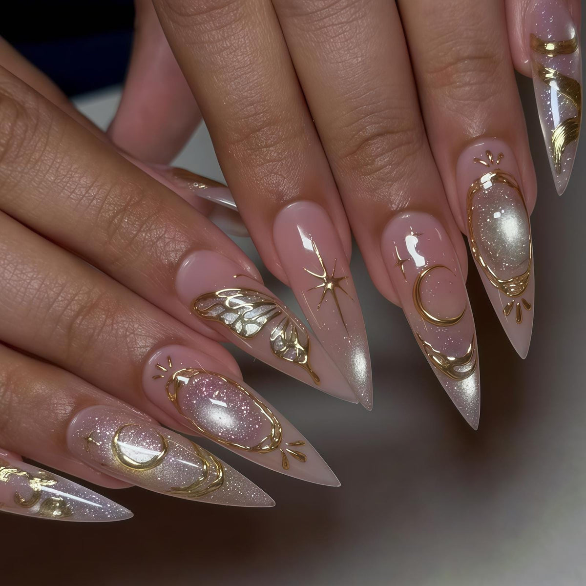 Blush Pink Nails With Ornate Gold Swirls and Reflective Accents