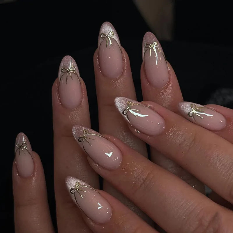 Blush Pink Nails With Silver Glitter Tips and Gold Bows