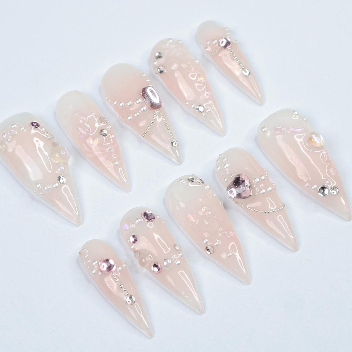 Blush Pink Pearl and Rhinestone Nails with Metallic Charms for Weddings