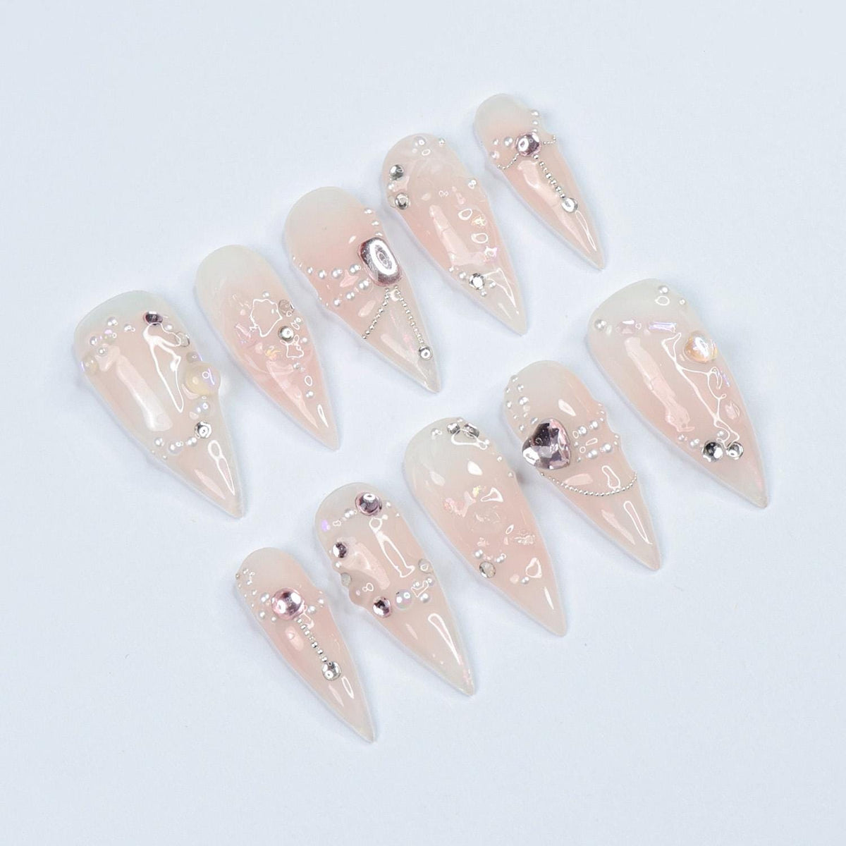Blush Pink Pearl and Rhinestone Nails with Metallic Charms for Weddings