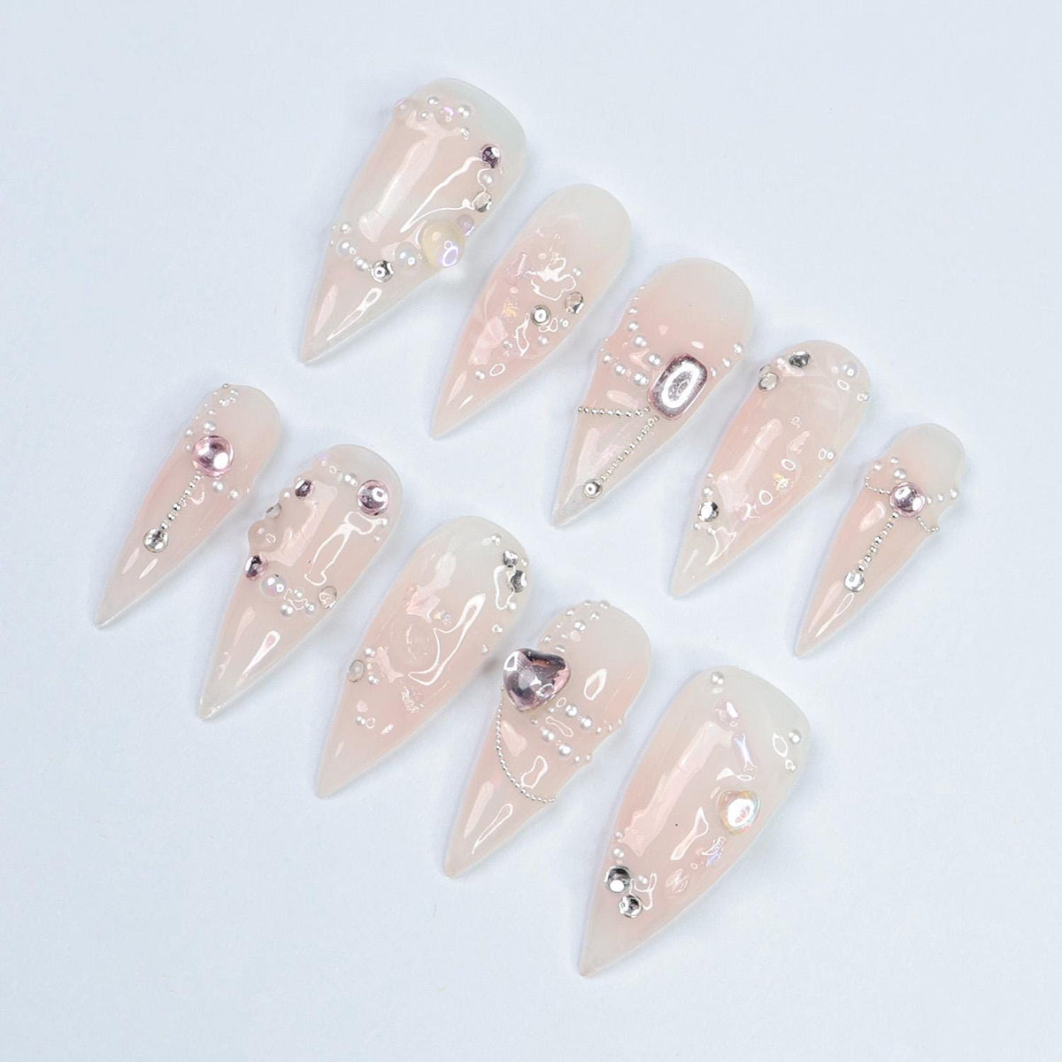 Blush Pink Pearl and Rhinestone Nails with Metallic Charms for Weddings