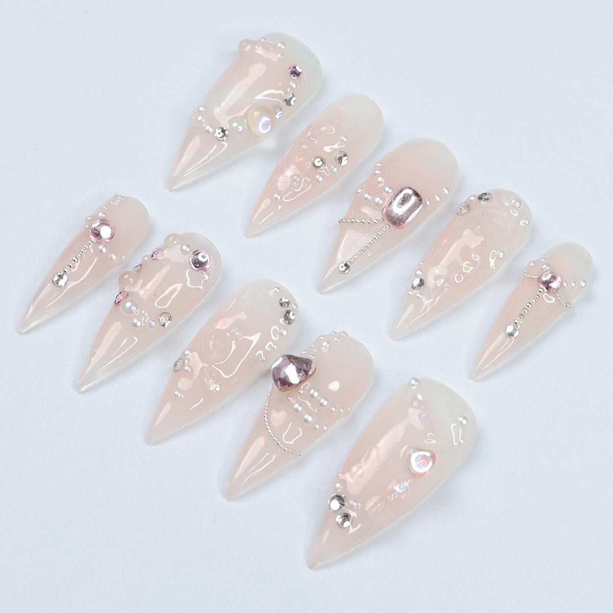 Blush Pink Pearl and Rhinestone Nails with Metallic Charms for Weddings