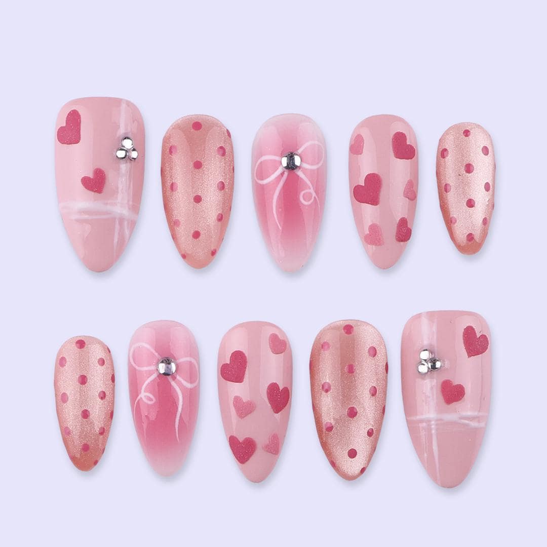 Blush Pink Valentine Nails with Hearts, Polka Dots, and Rhinestone Bows