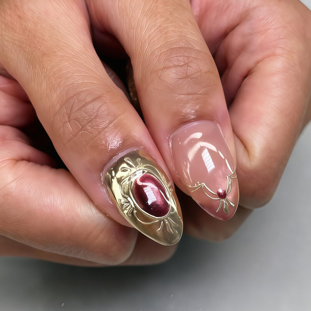 Blush Pink Wedding Nails With Gold Filigree and Burgundy Stone Details