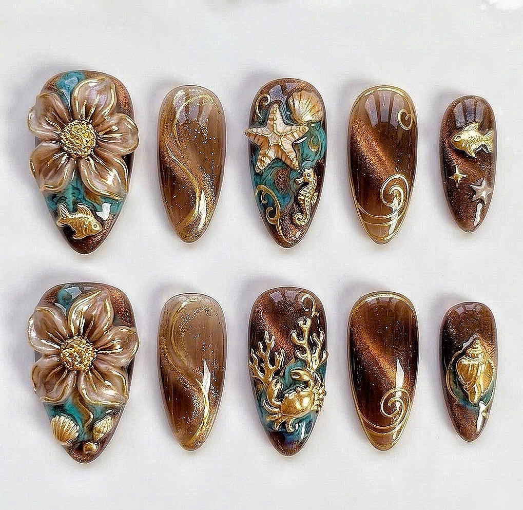 Brown and Bronze Cat Eye Ocean Nails with Raised Gold Sea Life Details