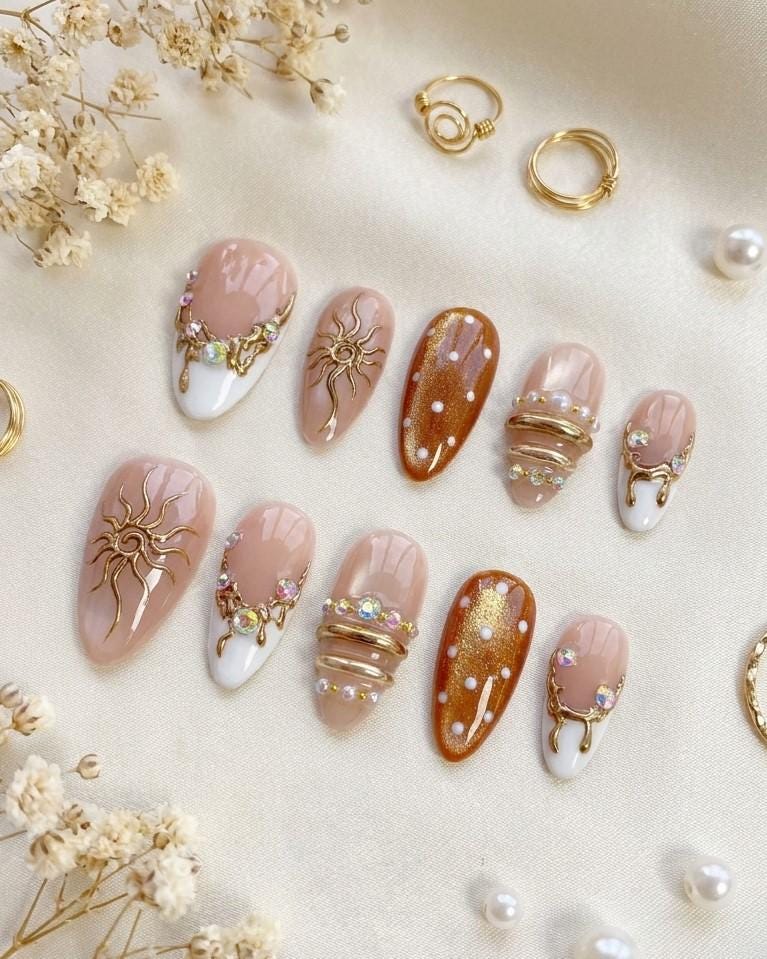 Brown Cat Eye and Blush French Tip Nails with Gold Sun Details
