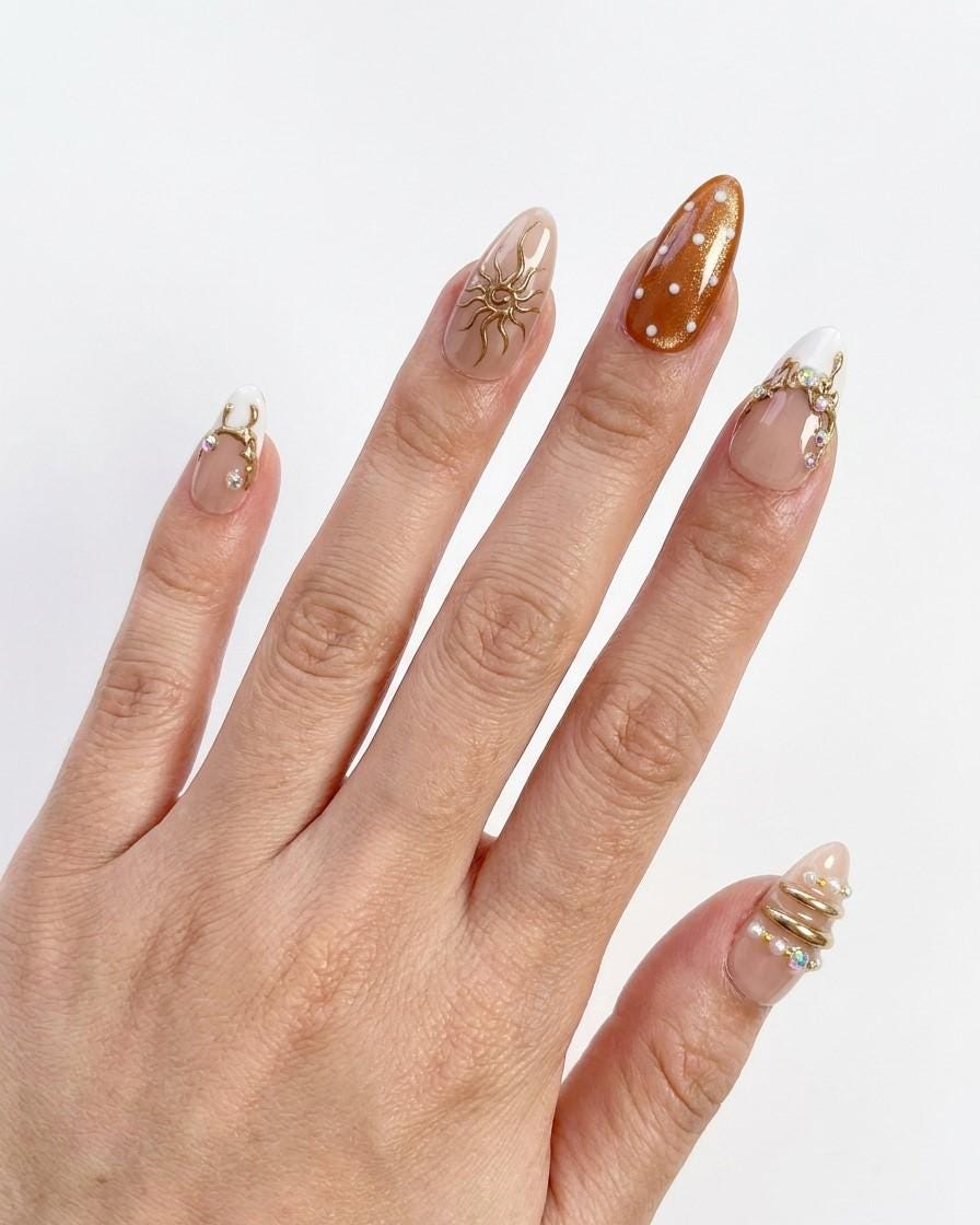 Brown Cat Eye and Blush French Tip Nails with Gold Sun Details