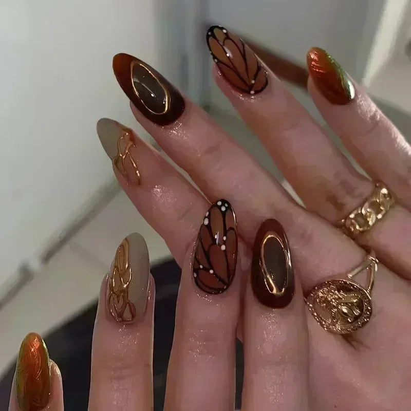 Brown Jelly Butterfly French Tip Nails With Gold Swirls