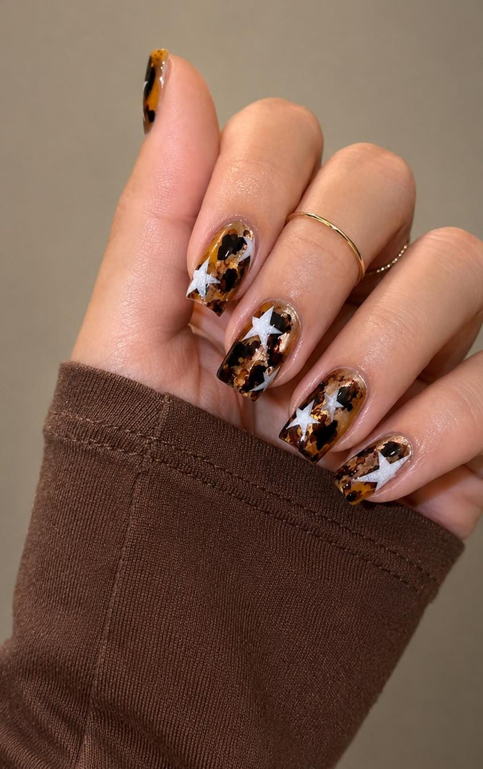 Brown Tortoiseshell Press-On Nails With White Stars and Gold Details