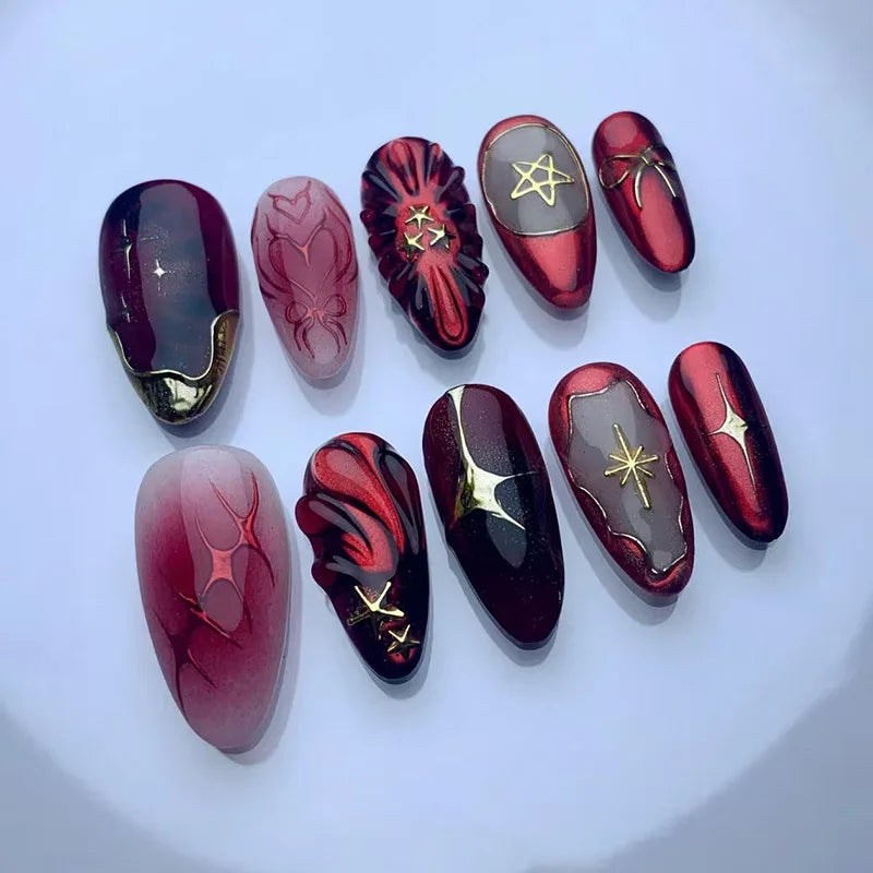 Burgundy and Black Starburst Nail Set With Gold Accents