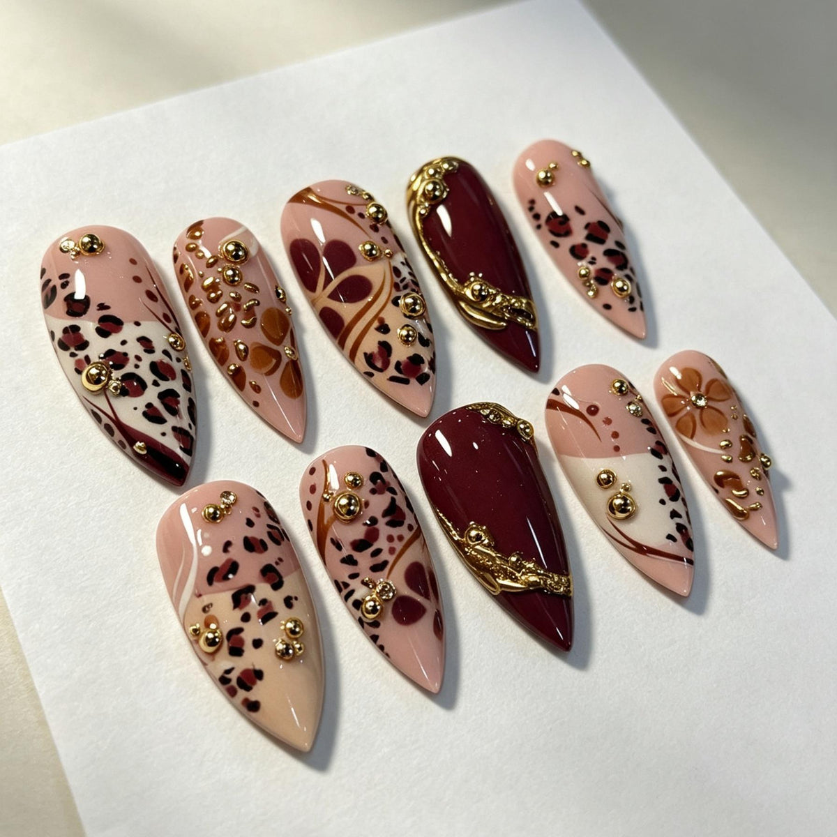Burgundy and Nude Leopard Print Nail Set With Gold Bead Accents