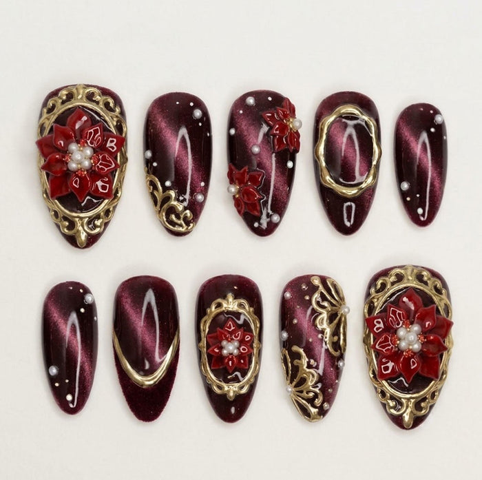 Burgundy Cat Eye Christmas Press On Nails With Red Poinsettias, Gold Scrollwork and Pearls